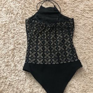 Black and gold body suit